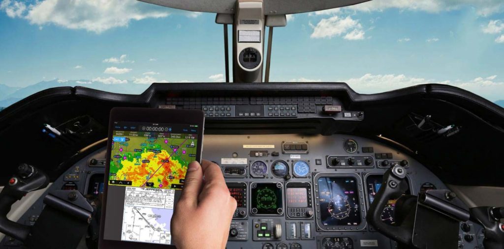 fuel level sae whitepapers showing iPad with flight path in a cockpit