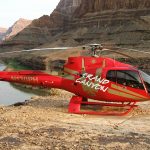 red and gold Papillon helicopter in the Grand Canyon