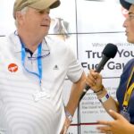image of Scott Philiben speaking to Aero News spokeswoman at OshKosh 2021